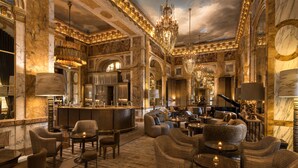 A luxurious interior with marble walls, chandeliers, and a piano. - Hôtel de Crillon A Rosewood Hotel (Paris)