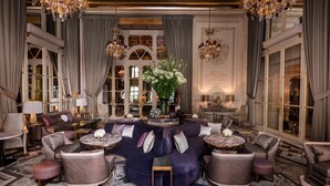 A luxurious living room with a large sectional sofa, round coffee tables, and elegant chandeliers. - Hôtel de Crillon A Rosewood Hotel (Paris)