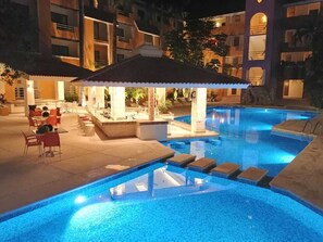 Outdoor pool, open 10:00 AM to 10:00 PM, pool umbrellas, sun loungers