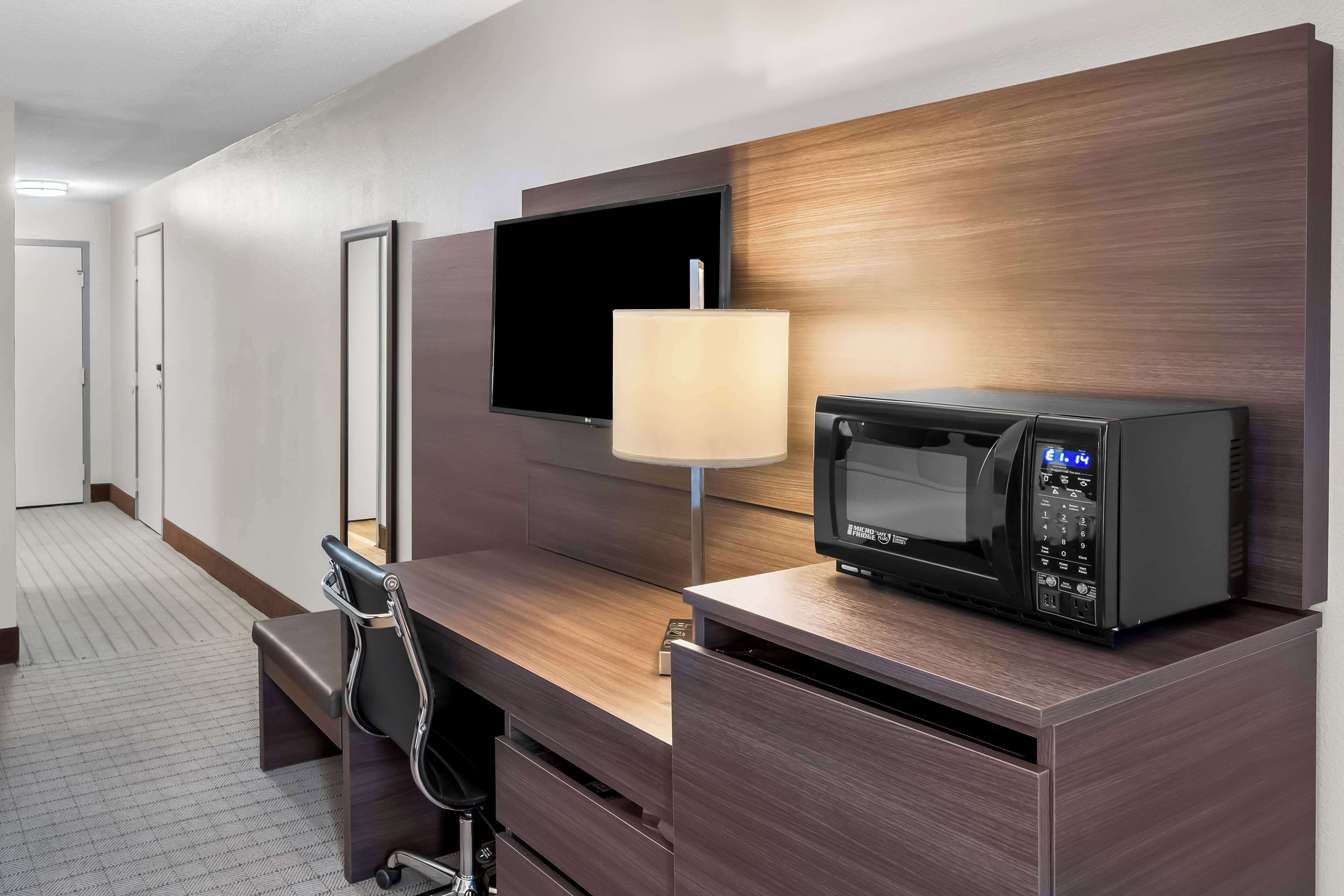 hypo-allergenic bedding, desk, laptop workspace, blackout curtains