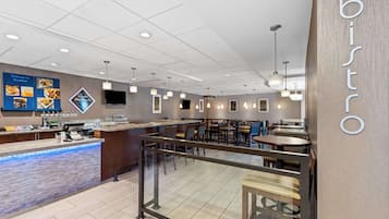 A modern bistro with a clean, minimalist design, featuring a central counter, seating area, and a visible menu board.