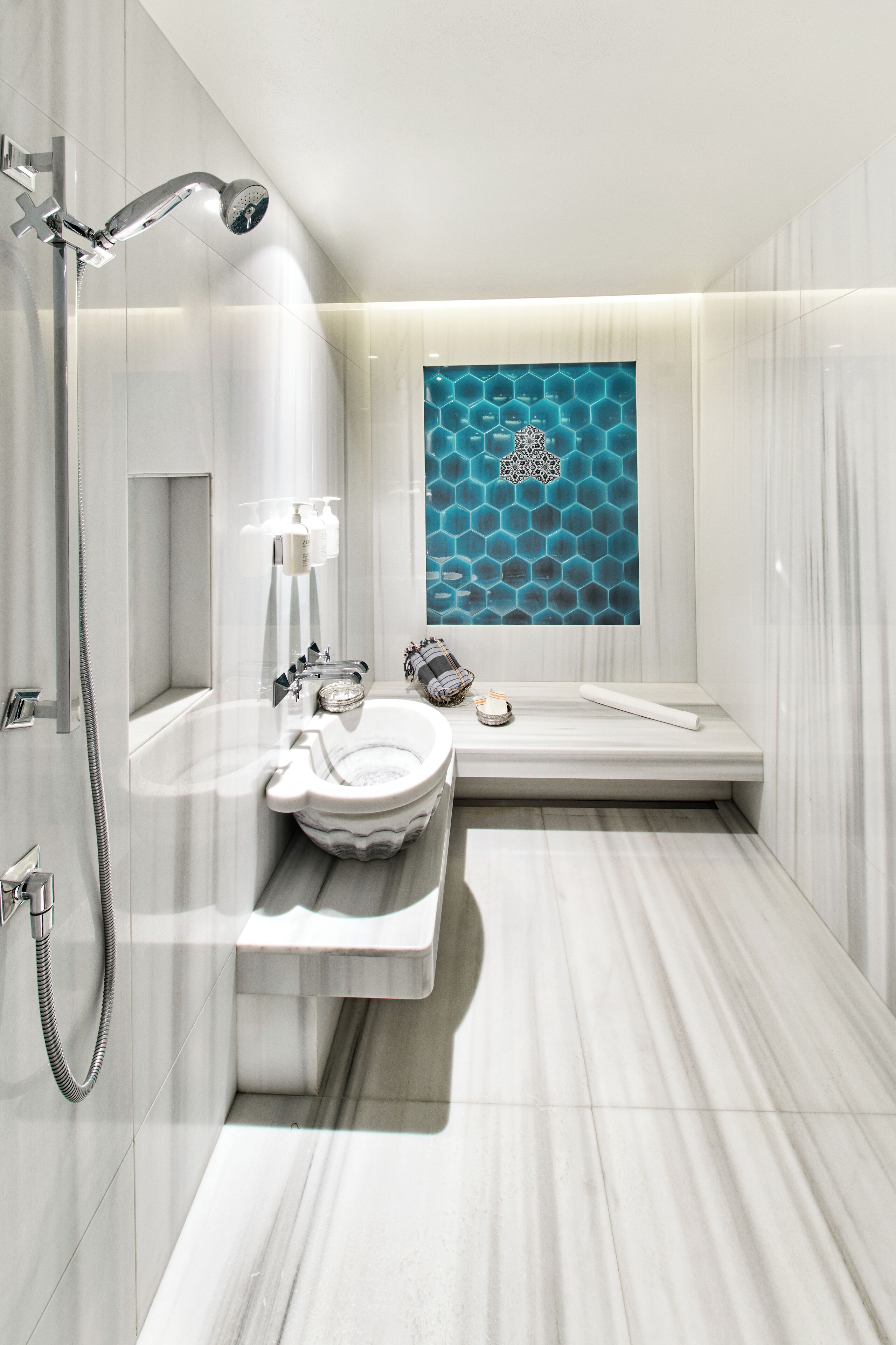 A modern bathroom with a freestanding bathtub, a shower, and a vanity with a mirror.