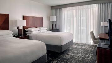 Premium bedding, desk, laptop workspace, iron/ironing board