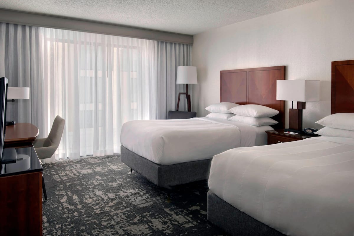 Premium bedding, desk, laptop workspace, iron/ironing board