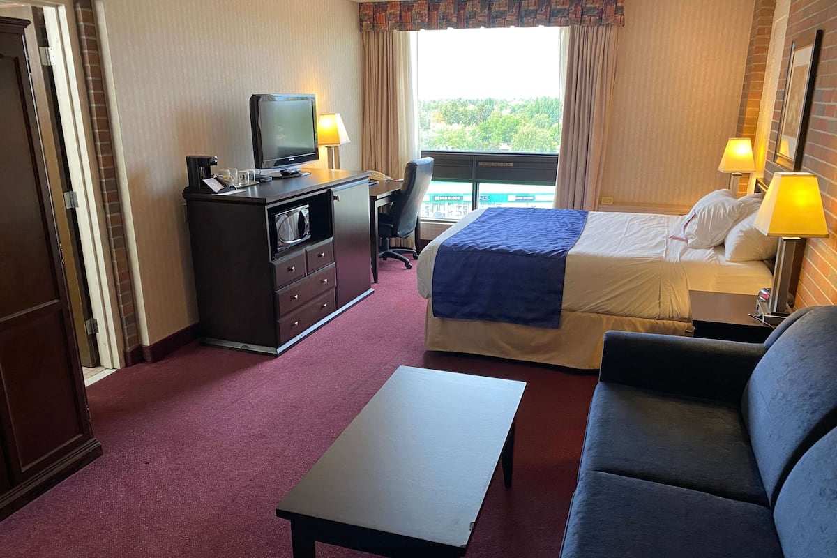 room, 1 queen bed with sofa bed, non smoking | in-room safe, desk, laptop workspace, blackout curtains