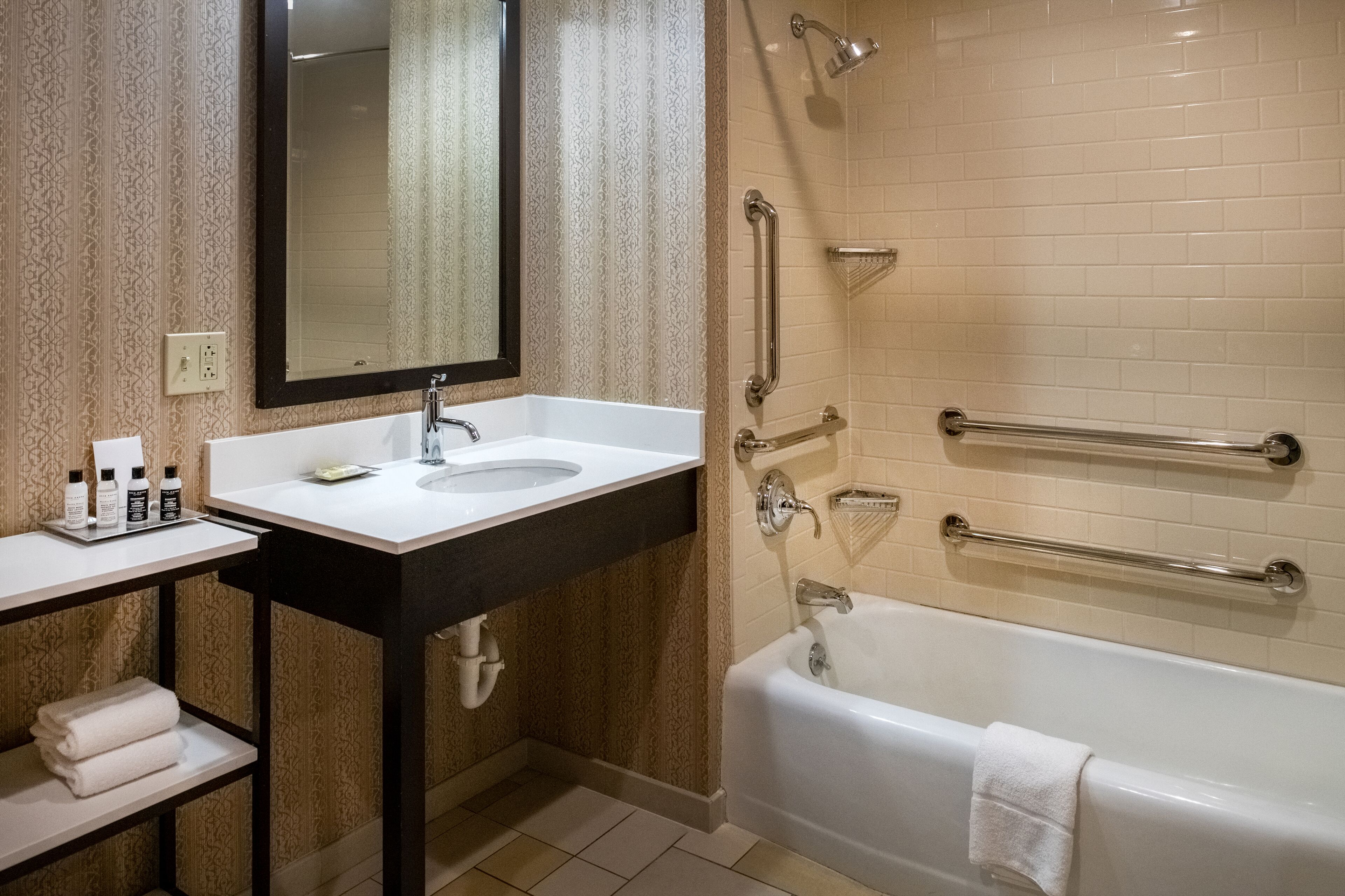 deluxe room, 1 king bed | bathroom | designer toiletries, hair dryer, towels, soap