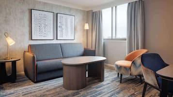 Premium Suite | Living area | 32-inch plasma TV with cable channels, TV