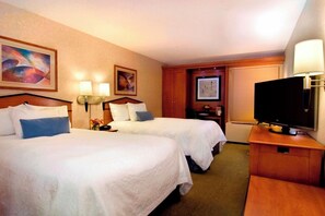 Premium bedding, desk, laptop workspace, blackout curtains