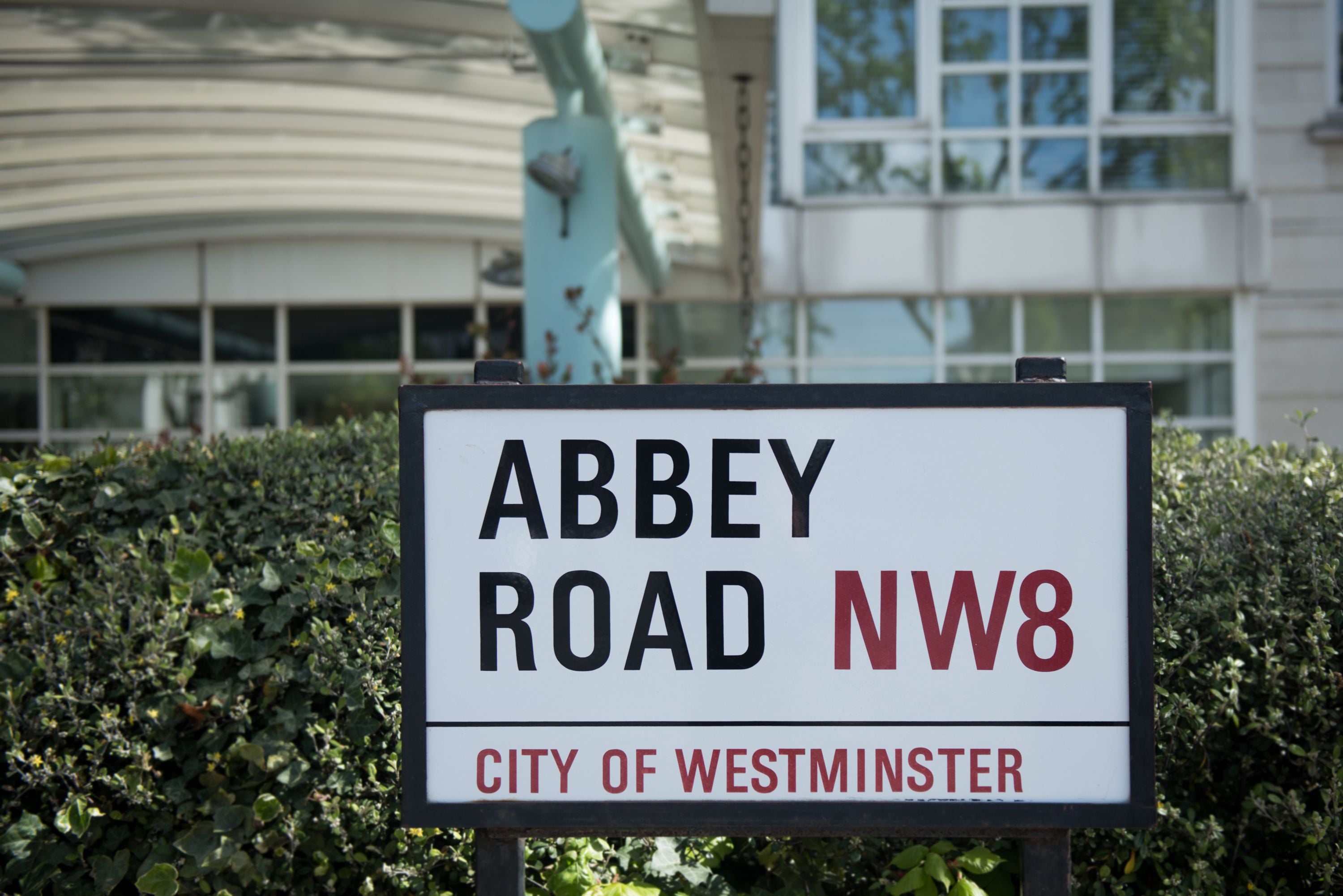 A street sign for Abbey Road NW8 in the City of Westminster.