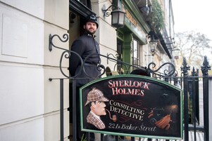 A Sherlock Holmes Consulting Detective sign at 221B Baker Street.