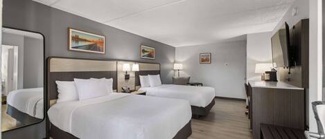 Premium bedding, desk, laptop workspace, blackout curtains