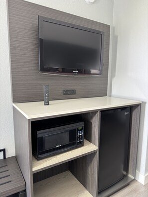 Premium bedding, desk, laptop workspace, blackout curtains