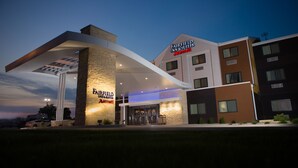 A Fairfield Inn & Suites Marriott hotel with a modern design, featuring a prominent entrance and a covered outdoor area. - Fairfield Inn & Suites by Marriott Burlington (Burlington)