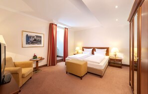 Premium bedding, down comforters, minibar, in-room safe