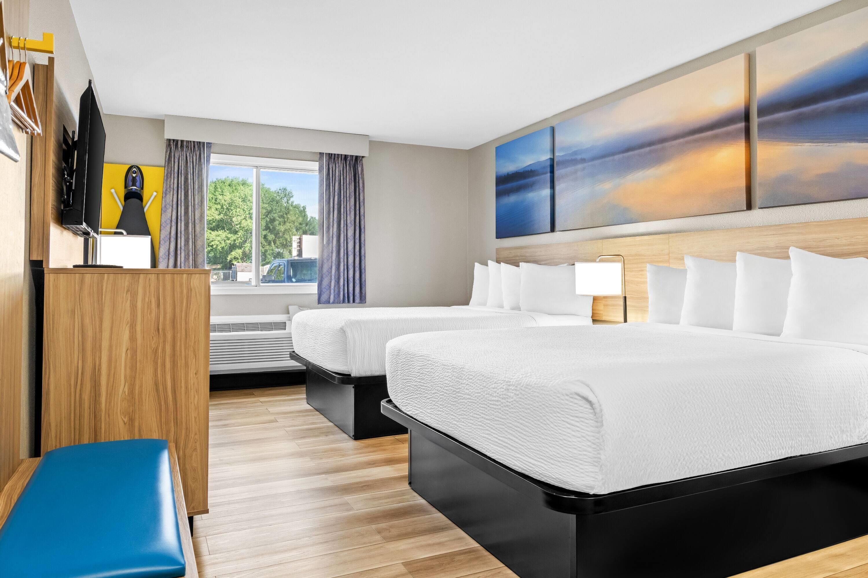 room, 2 queen beds, non smoking | desk, iron/ironing board, free cots/infant beds, travel cot