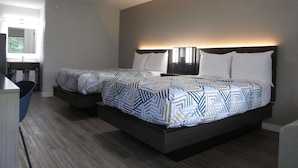 A modern hotel room with a large bed, a desk, and a window. - Motel 6 Brookhaven, MS (Brookhaven)