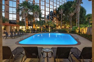 Outdoor pool, open 7:00 AM to 10:00 PM, sun loungers