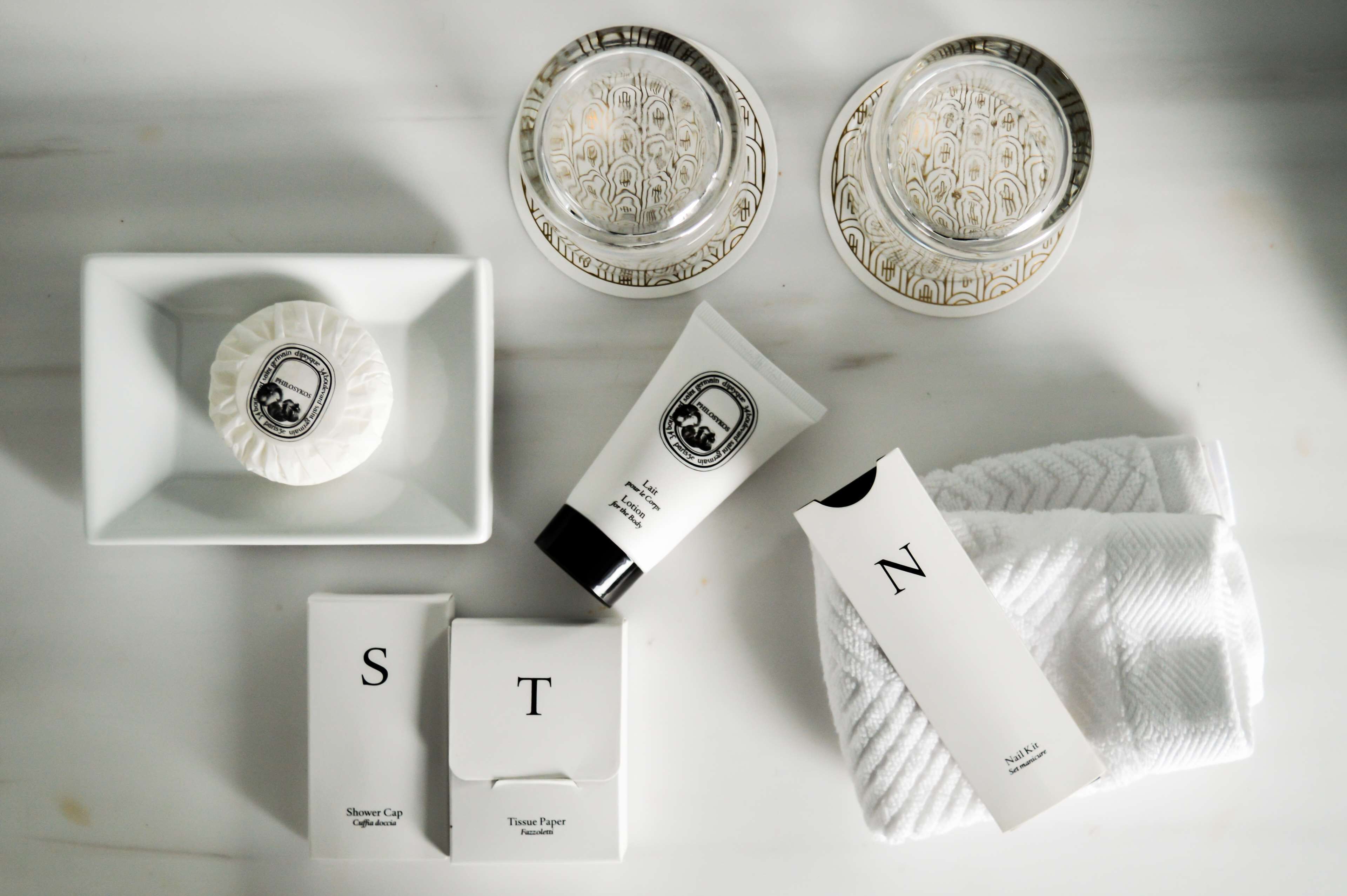 designer toiletries, hair dryer, bathrobes, slippers