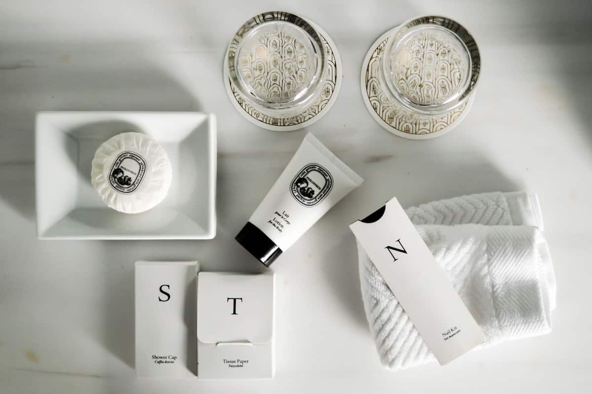 designer toiletries, hair dryer, bathrobes, slippers