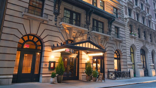 The Evelyn Hotel with a classic facade, large windows, and a prominent entrance. - The Evelyn Hotel (New York)