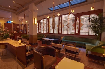 Sitting area in hotel lobby at The Evelyn Hotel