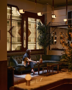 Sitting area in hotel lobby at The Evelyn Hotel