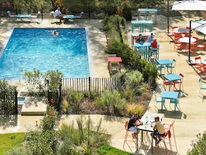 Seasonal outdoor pool, open 10:00 AM to 10:00 PM, pool loungers