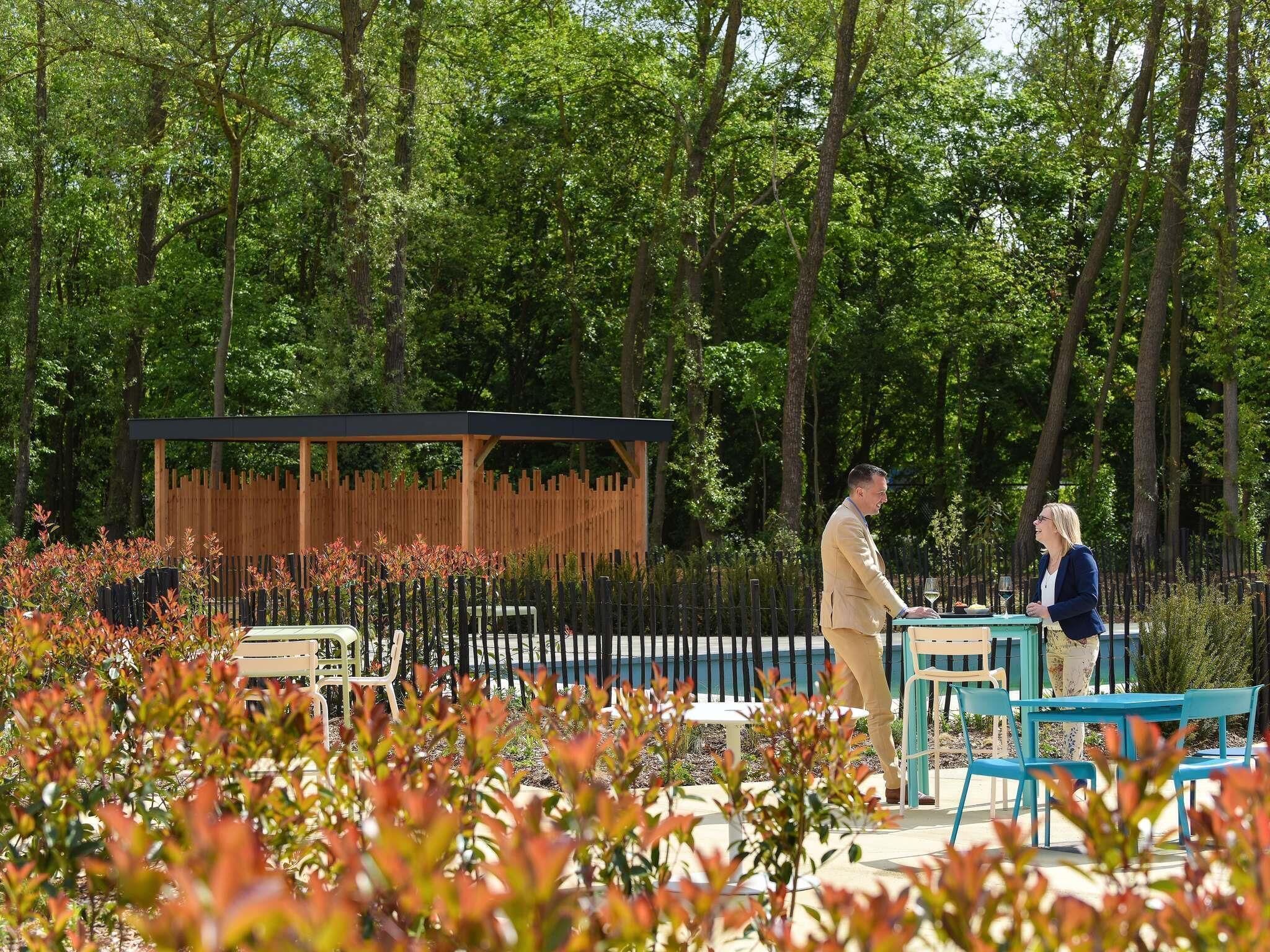 Seasonal outdoor pool, open 10:00 AM to 10:00 PM, pool loungers