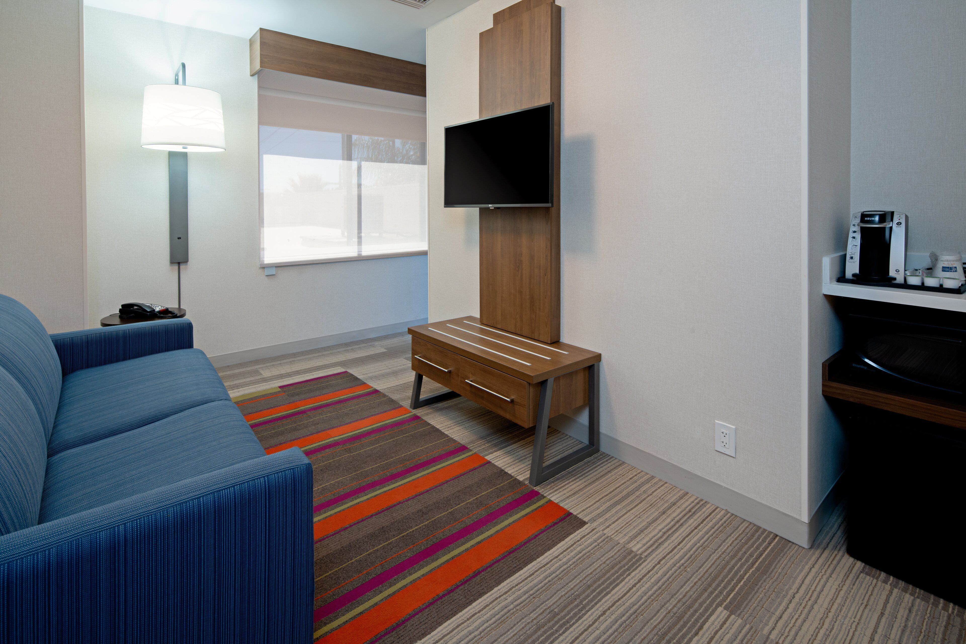 suite, 1 king bed, roll-in shower (roll-in shower) | 1 bedroom, in-room safe, desk, laptop workspace