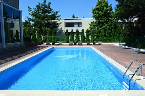 Seasonal outdoor pool, open 7 AM to 10 PM, pool loungers
