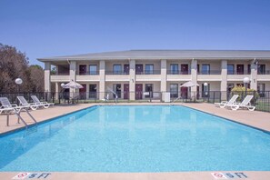 Seasonal outdoor pool, pool loungers