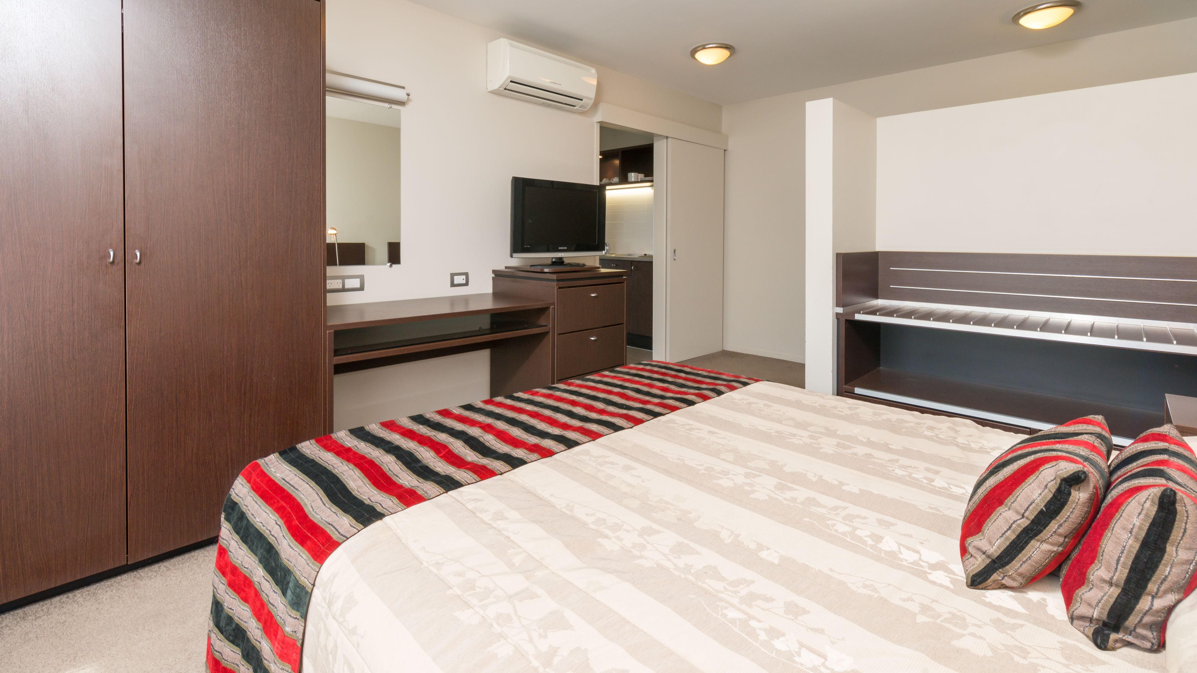 junior suite | in-room safe, desk, blackout curtains, iron/ironing board