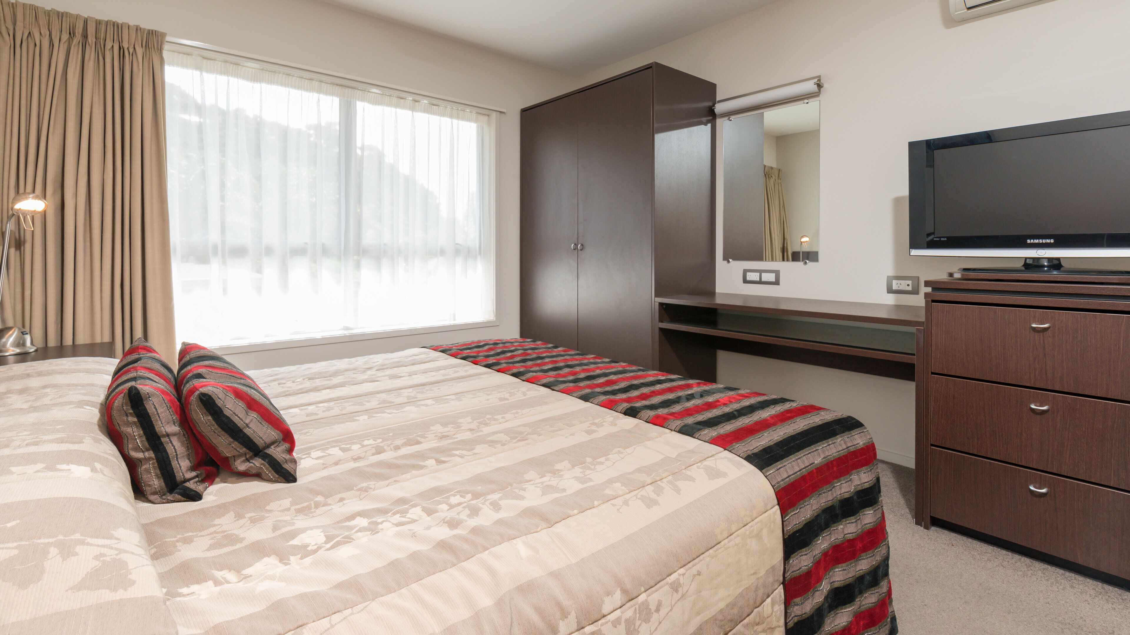 junior suite | in-room safe, desk, blackout curtains, iron/ironing board