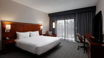 Premium bedding, desk, laptop workspace, iron/ironing board