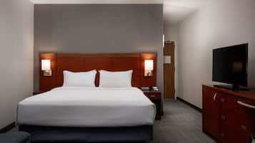 Premium bedding, desk, laptop workspace, iron/ironing board