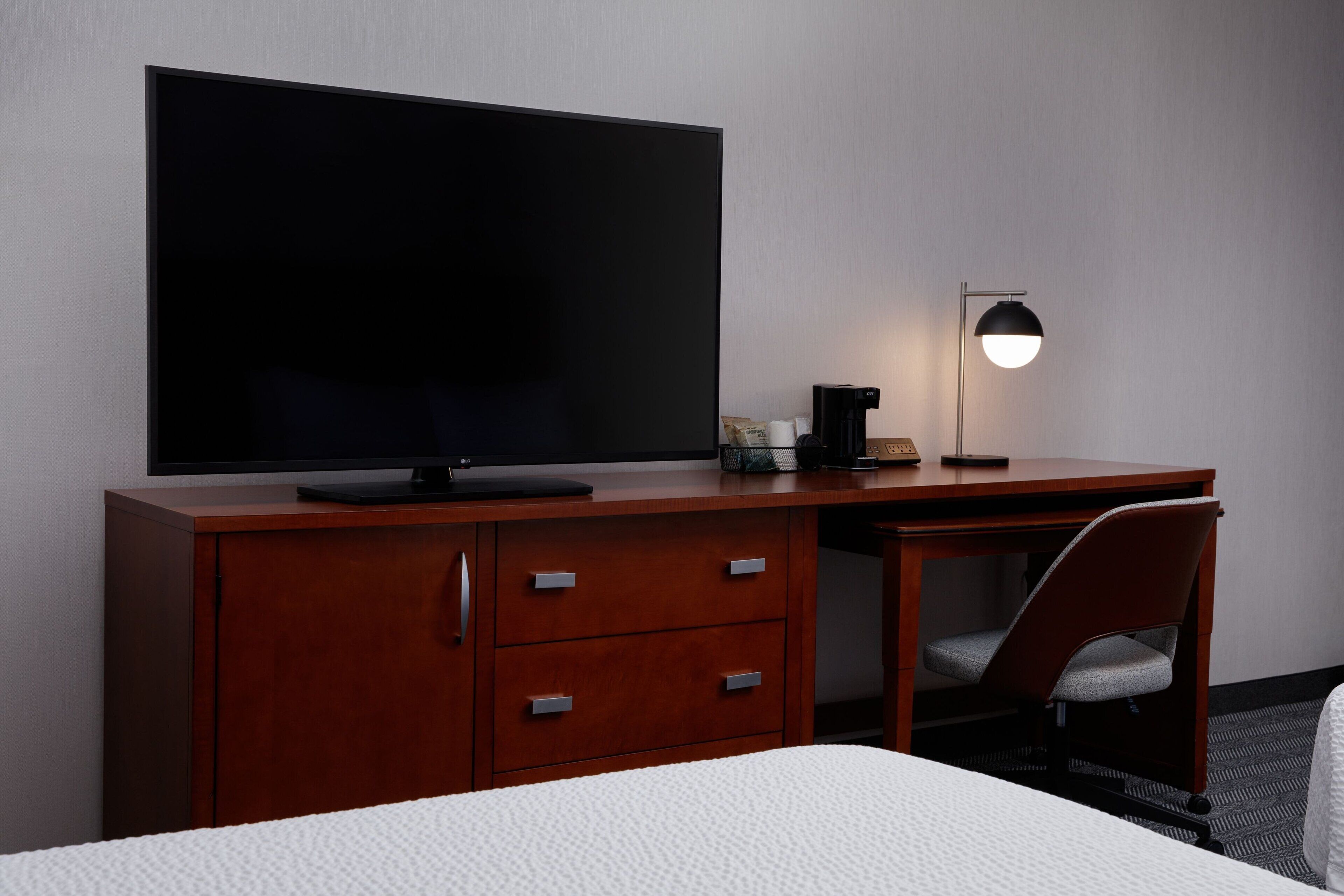 premium bedding, desk, laptop workspace, iron/ironing board