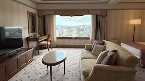 A hotel room with a city view, a television, a desk, and a sofa. - Hotel Nikko Princess Kyoto (Kyoto)