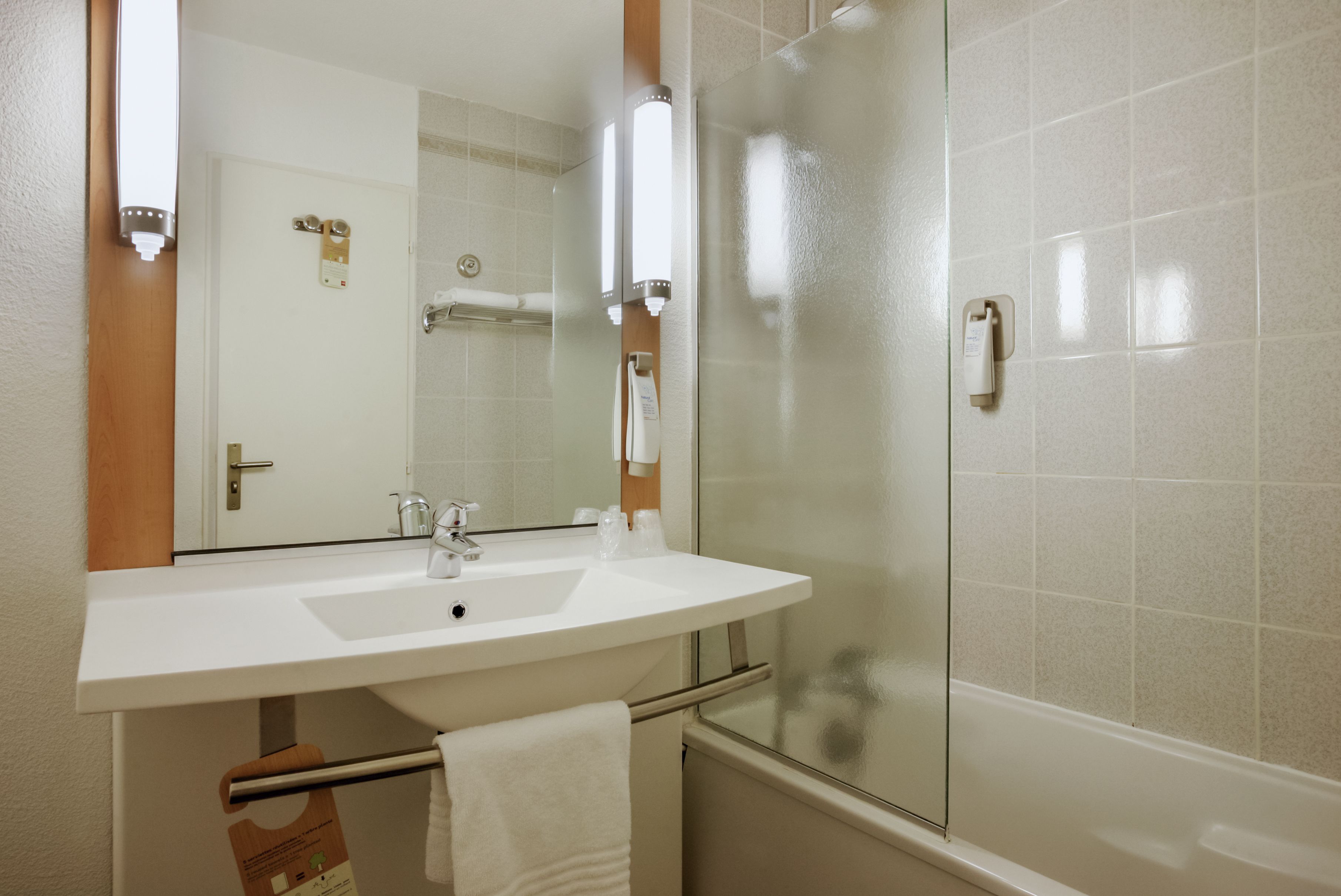 eco-friendly toiletries, hair dryer, towels, soap