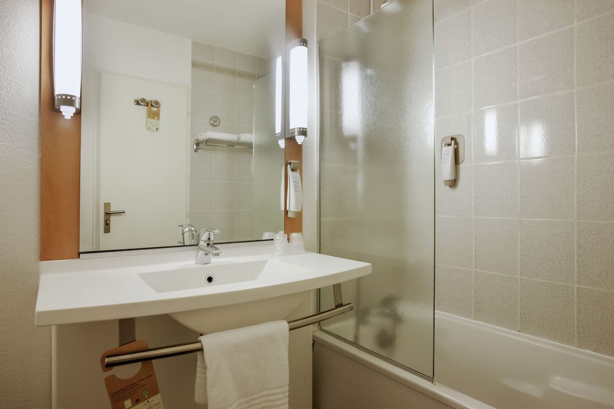 eco-friendly toiletries, hair dryer, towels, soap