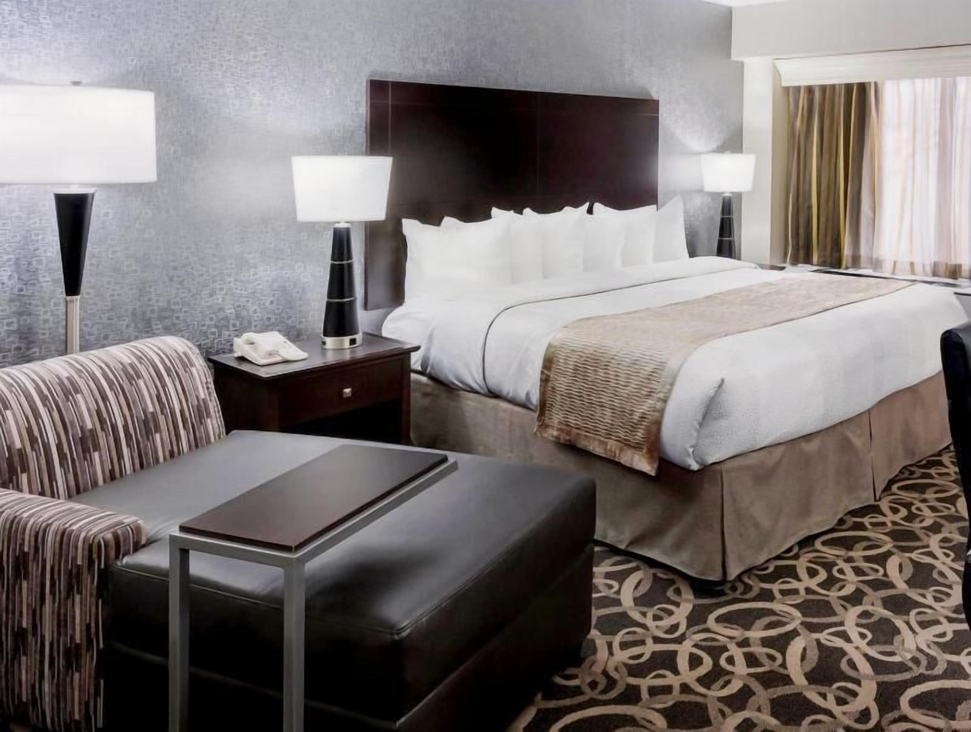 Premium bedding, pillow-top beds, desk, laptop workspace