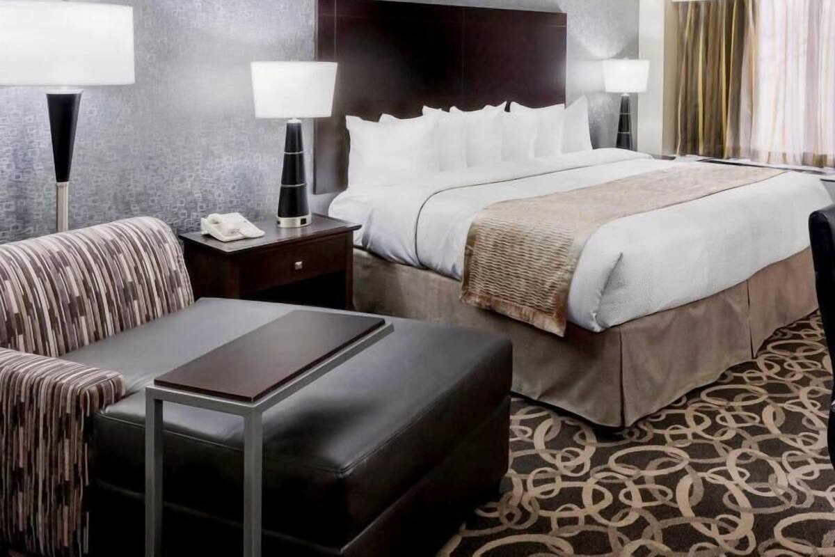 Premium bedding, pillow-top beds, desk, laptop workspace