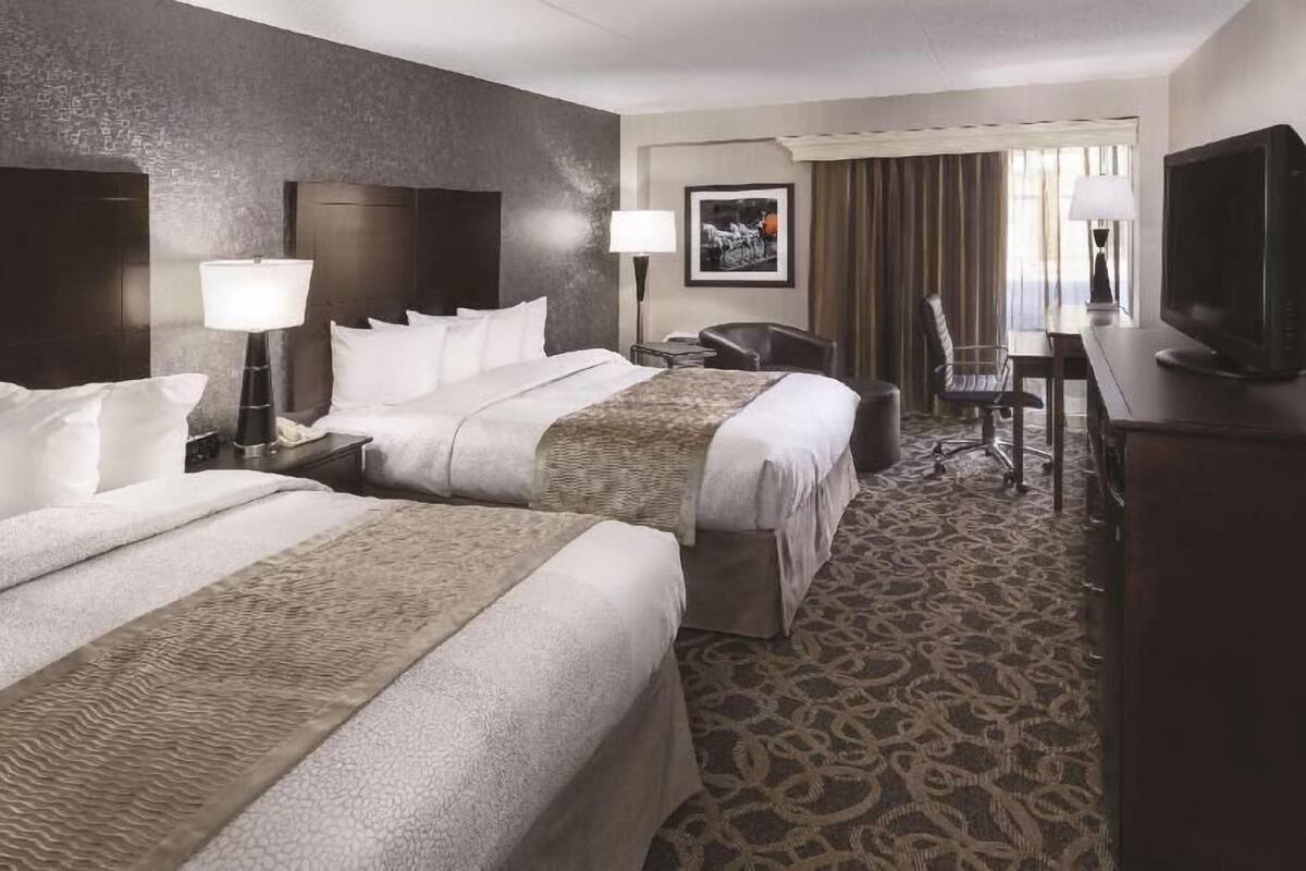 Premium bedding, pillow-top beds, desk, laptop workspace