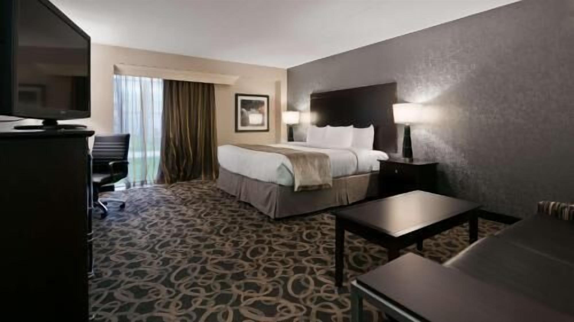 Premium bedding, pillow-top beds, desk, laptop workspace