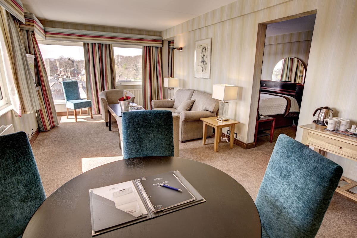 junior suite | in-room safe, desk, laptop workspace, blackout curtains