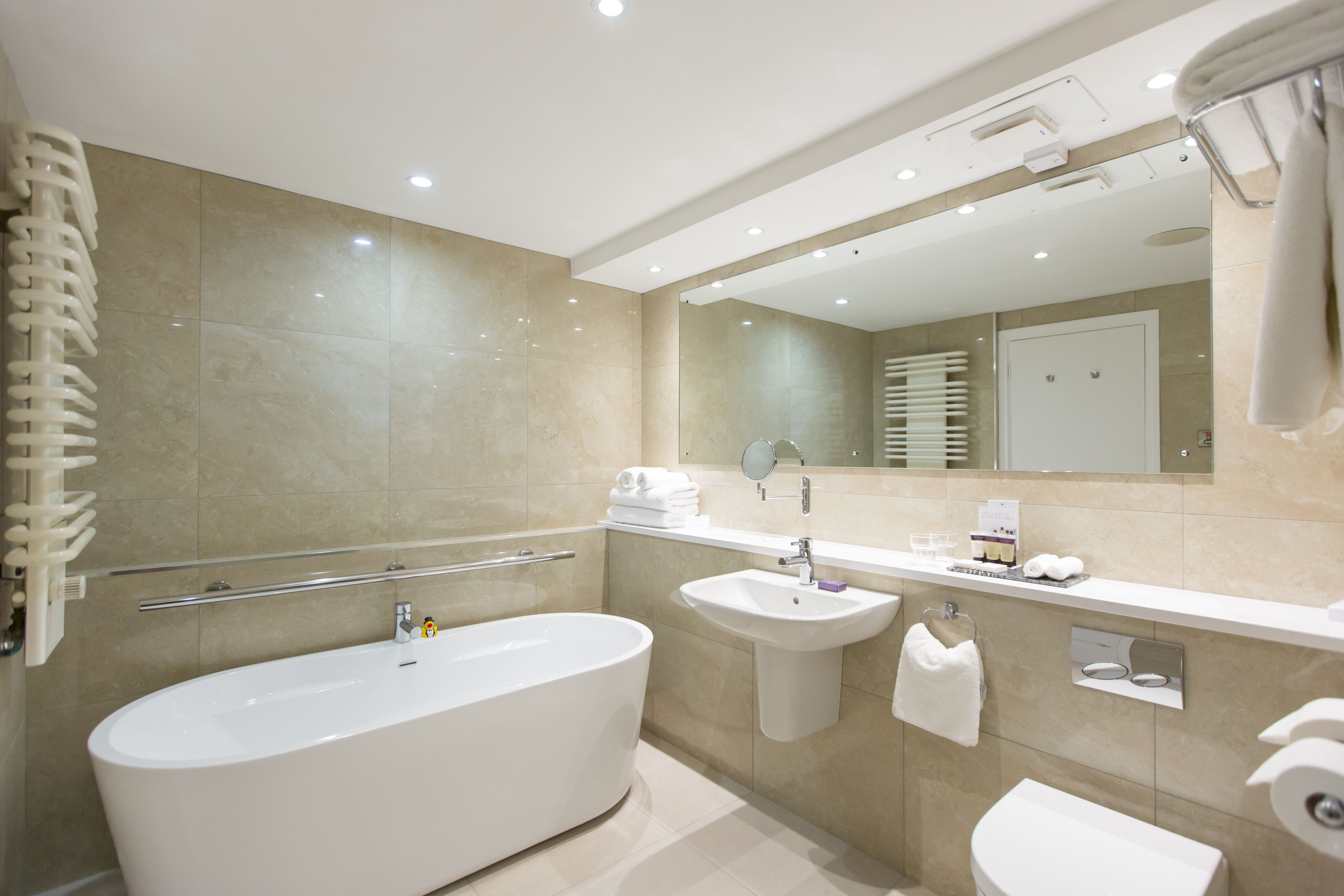junior suite | bathroom | shower, free toiletries, hair dryer, towels