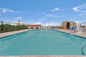 Seasonal outdoor pool, open 10:00 AM to 10 PM, pool umbrellas