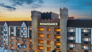 A Renaissance hotel with a stone facade, multiple windows, and a prominent sign. - Renaissance Framingham Hotel & Conference Center (Framingham)