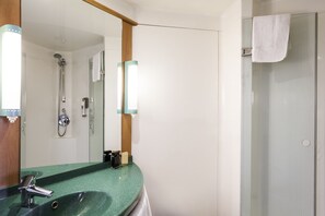 Shower, eco-friendly toiletries, hair dryer, towels