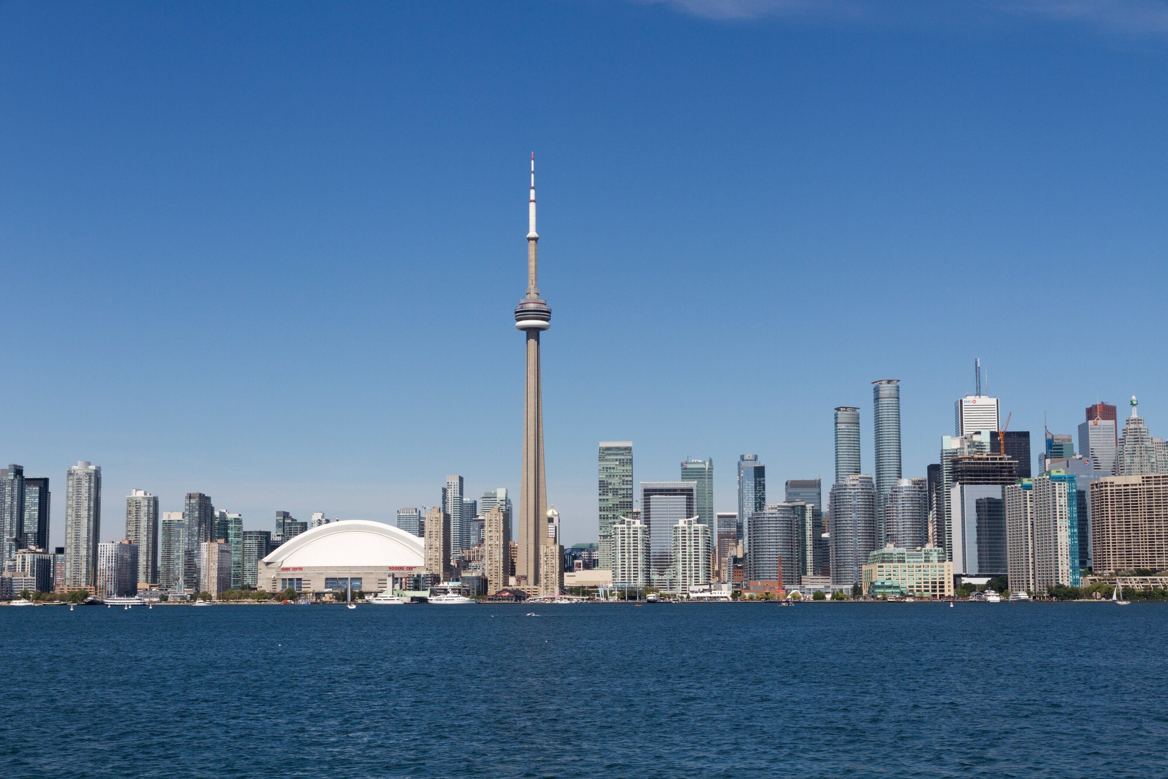 A city skyline with a prominent tower and a large dome-shaped building.