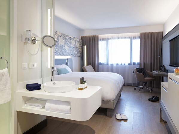 Luxe beddengoed, een kluis op de kamer, een bureau